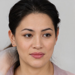 Joyful white young-adult female with medium  brown hair and brown eyes