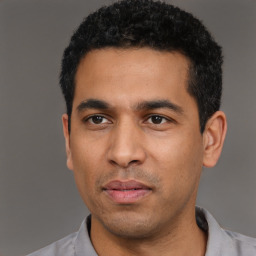 Neutral latino young-adult male with short  black hair and brown eyes