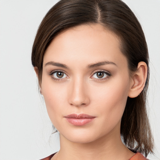 Neutral white young-adult female with medium  brown hair and brown eyes