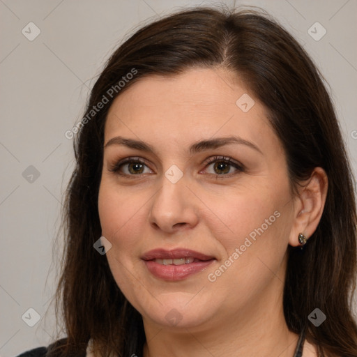 Joyful white adult female with medium  brown hair and brown eyes