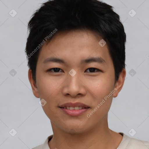 Joyful asian young-adult male with short  black hair and brown eyes