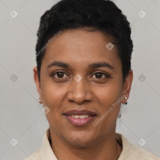 Joyful black young-adult female with short  black hair and brown eyes