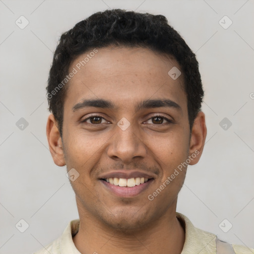 Joyful latino young-adult male with short  black hair and brown eyes