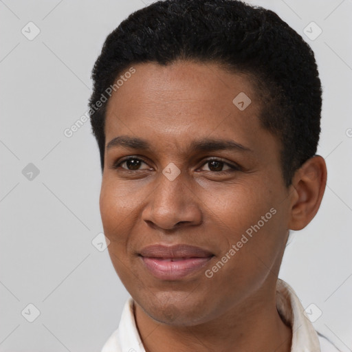 Joyful black young-adult male with short  black hair and brown eyes