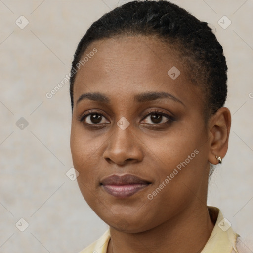 Joyful black young-adult female with short  brown hair and brown eyes