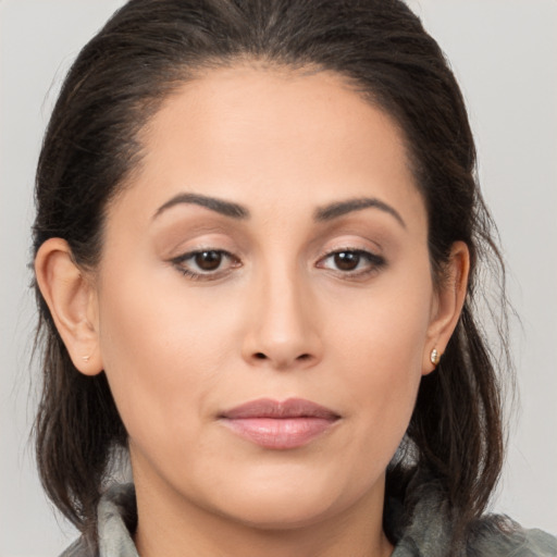 Joyful white young-adult female with medium  brown hair and brown eyes