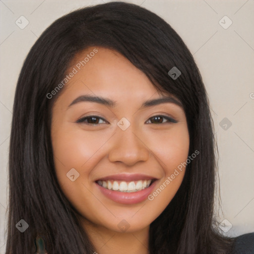 Joyful latino young-adult female with long  brown hair and brown eyes