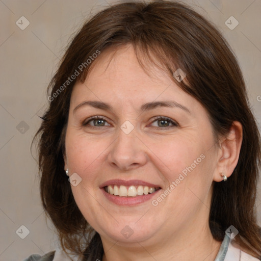 Joyful white adult female with medium  brown hair and grey eyes