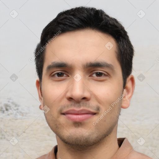 Joyful latino young-adult male with short  black hair and brown eyes