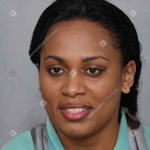 Joyful black young-adult female with short  black hair and brown eyes