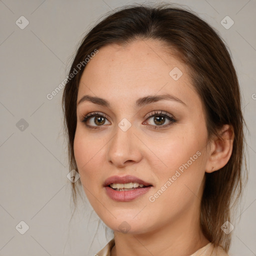 Joyful white young-adult female with medium  brown hair and brown eyes