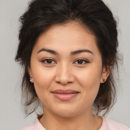 Joyful white young-adult female with medium  brown hair and brown eyes