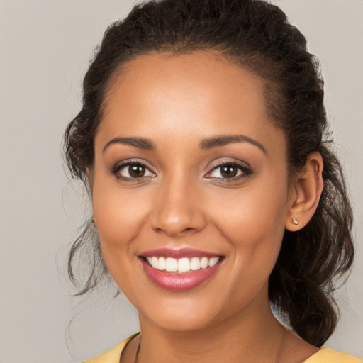 Joyful white young-adult female with long  brown hair and brown eyes