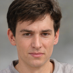 Joyful white adult male with short  brown hair and grey eyes