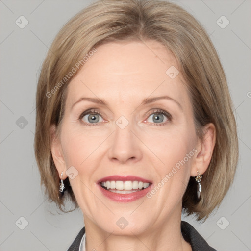 Joyful white adult female with medium  brown hair and blue eyes