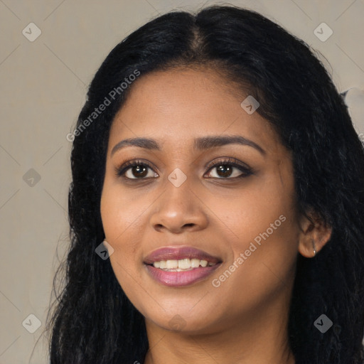 Joyful black young-adult female with long  black hair and brown eyes