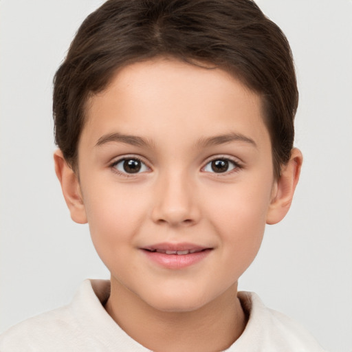 Joyful white child female with short  brown hair and brown eyes