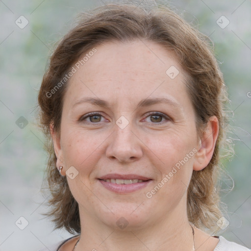 Joyful white adult female with medium  brown hair and grey eyes