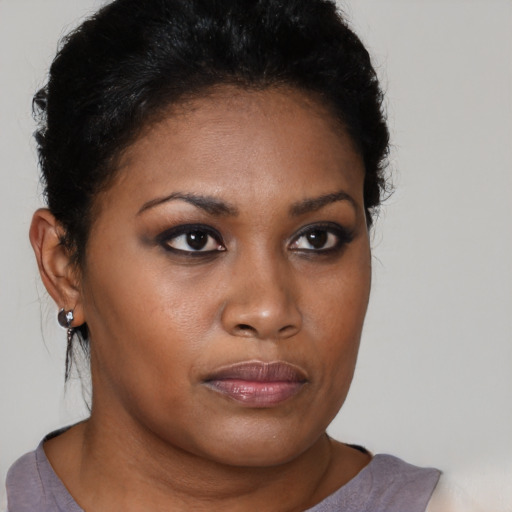 Neutral black young-adult female with short  brown hair and brown eyes