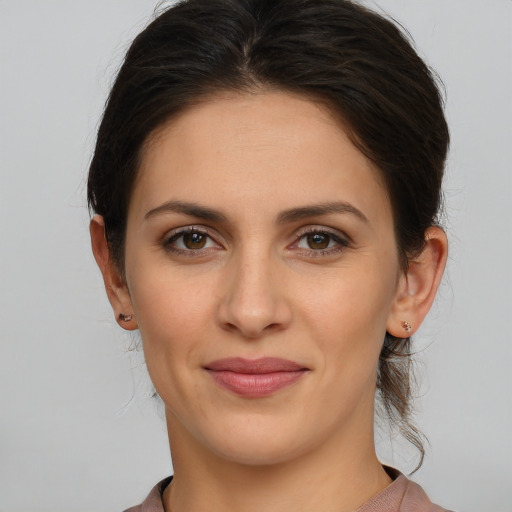 Joyful white young-adult female with long  brown hair and grey eyes