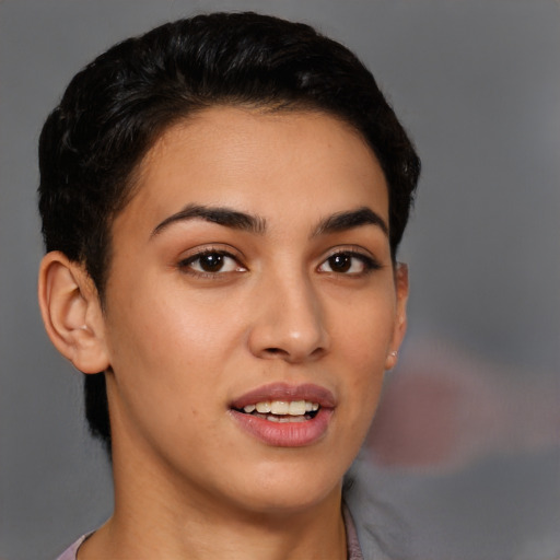 Joyful latino young-adult female with short  brown hair and brown eyes