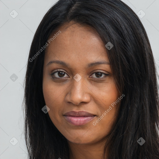 Joyful black young-adult female with long  brown hair and brown eyes