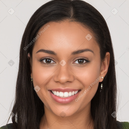 Joyful latino young-adult female with long  brown hair and brown eyes