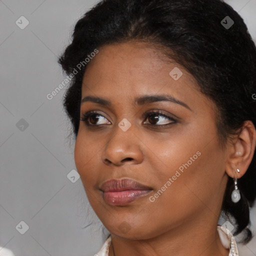 Joyful black young-adult female with medium  brown hair and brown eyes