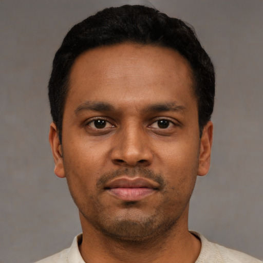 Neutral latino young-adult male with short  black hair and brown eyes