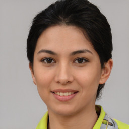 Joyful asian young-adult female with short  brown hair and brown eyes