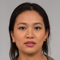 Joyful asian young-adult female with medium  brown hair and brown eyes