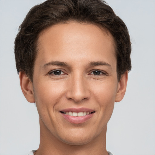 Joyful white young-adult female with short  brown hair and brown eyes