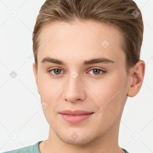 Joyful white young-adult female with short  brown hair and grey eyes