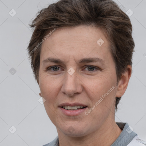 Joyful white adult female with short  brown hair and brown eyes