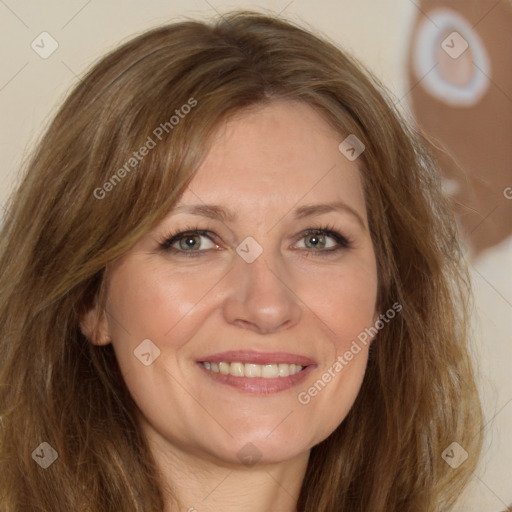 Joyful white adult female with long  brown hair and brown eyes