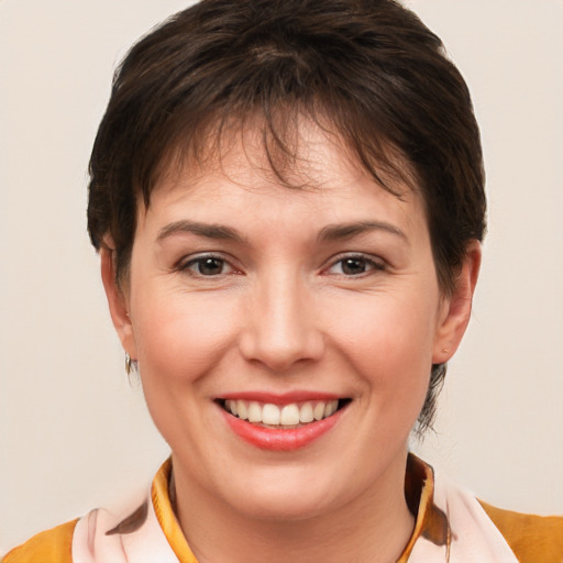 Joyful white young-adult female with short  brown hair and brown eyes