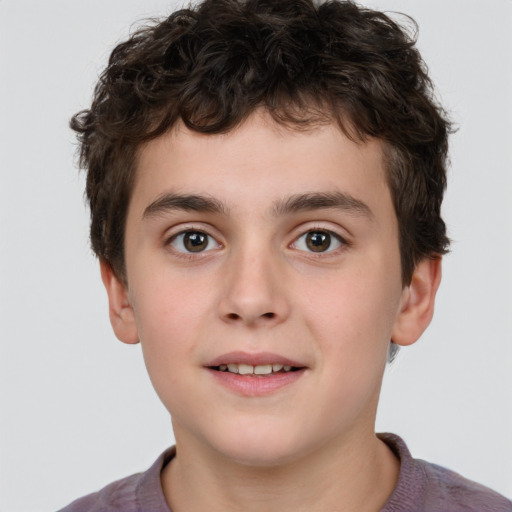 Joyful white child male with short  brown hair and brown eyes