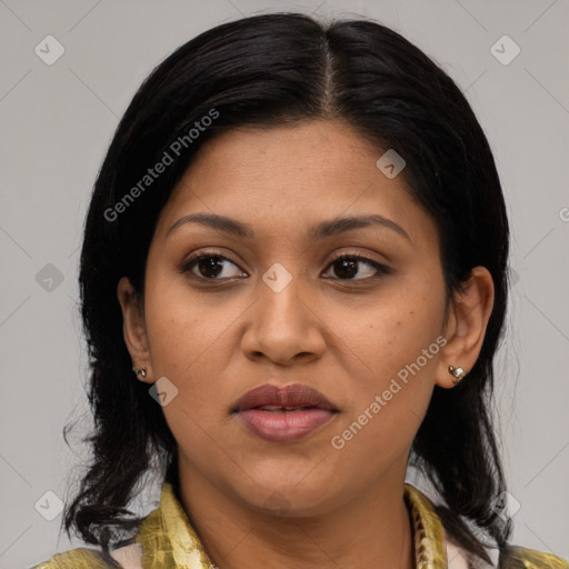 Joyful latino young-adult female with medium  brown hair and brown eyes