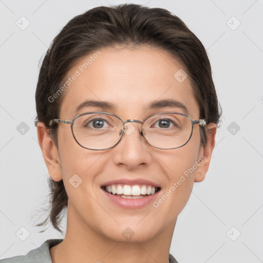 Joyful white adult female with short  brown hair and brown eyes