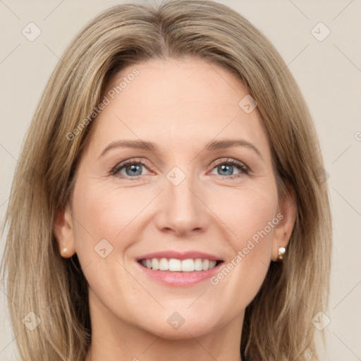 Joyful white young-adult female with medium  brown hair and green eyes