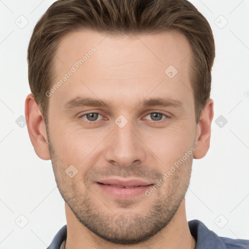 Joyful white young-adult male with short  brown hair and grey eyes