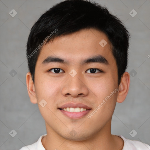 Joyful asian young-adult male with short  black hair and brown eyes