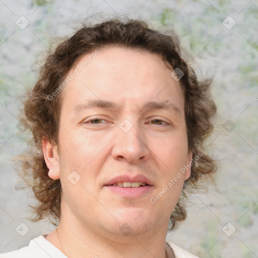 Joyful white adult male with medium  brown hair and brown eyes