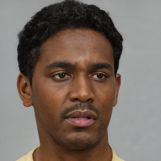 Neutral black young-adult male with short  brown hair and brown eyes