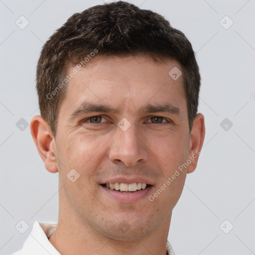 Joyful white young-adult male with short  brown hair and brown eyes