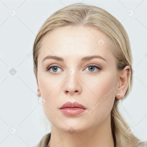 Neutral white young-adult female with long  brown hair and blue eyes