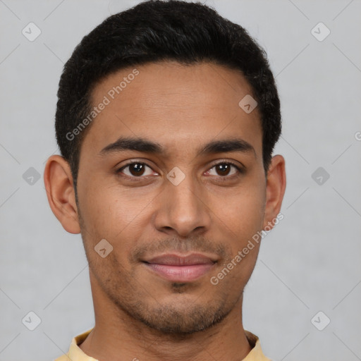 Joyful latino young-adult male with short  brown hair and brown eyes