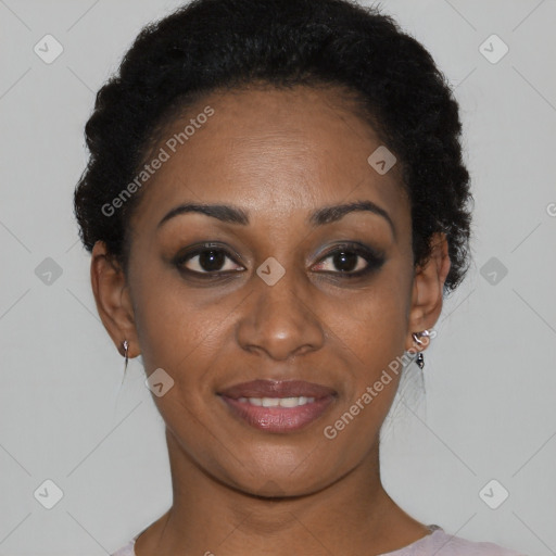 Joyful black young-adult female with short  black hair and brown eyes