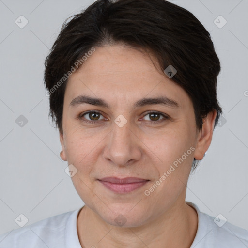 Joyful white adult female with short  brown hair and brown eyes