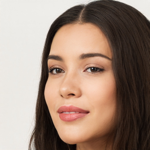 Joyful white young-adult female with long  black hair and brown eyes